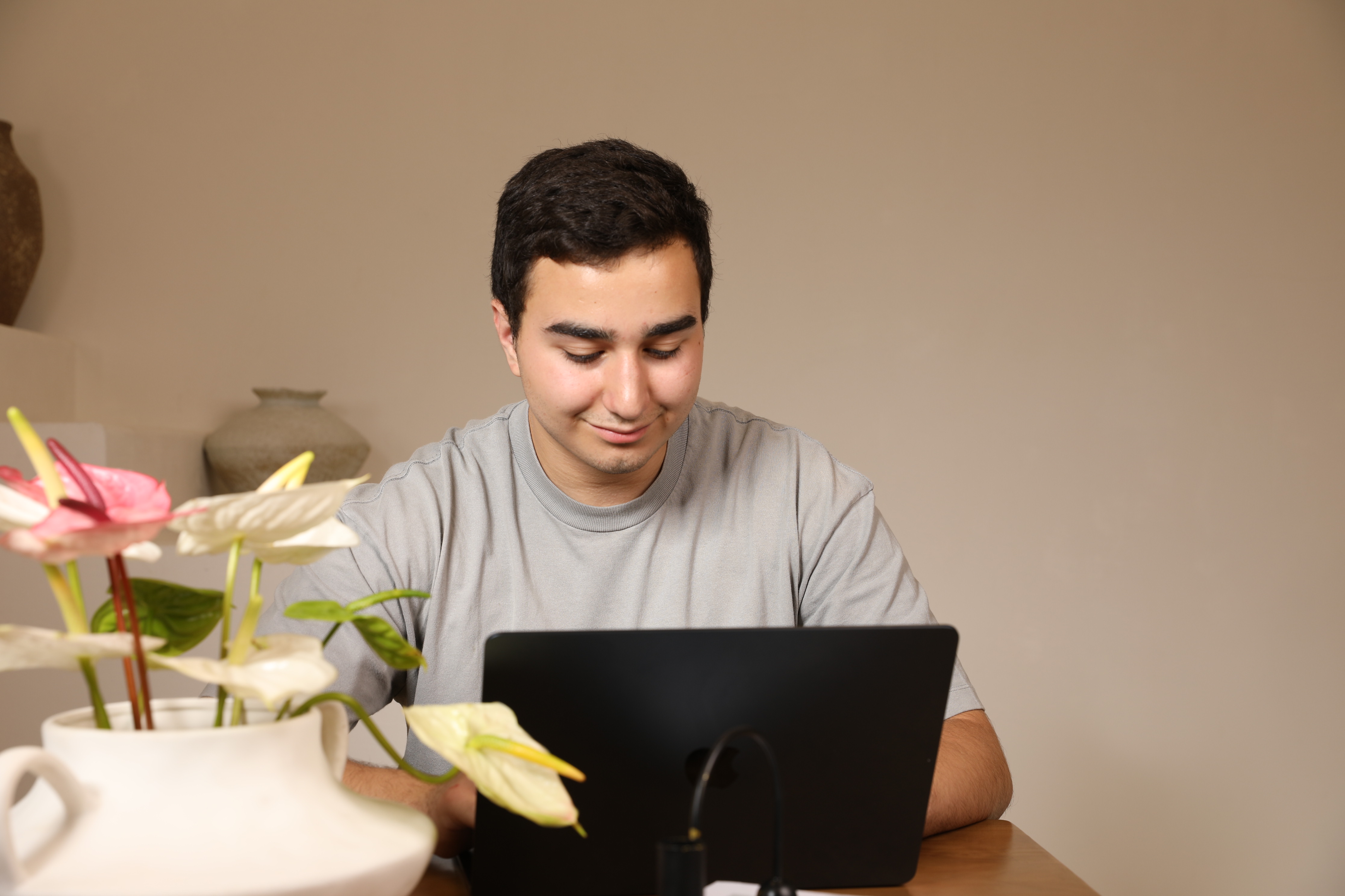 Armen Ghazaryan working at laptop - Product Owner at Playtronix, Yerevan Armenia